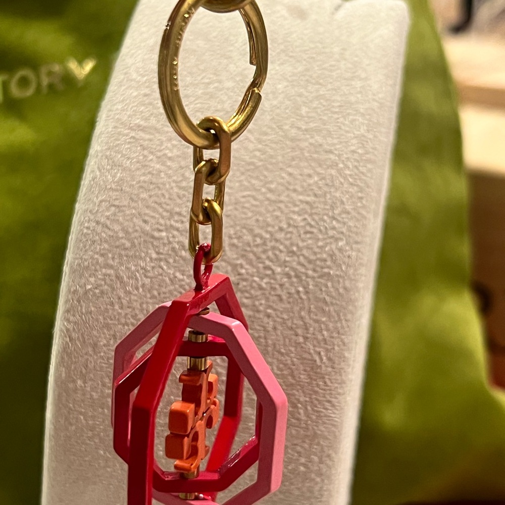 Tory Burch Rotating Geo Key Fob/bag charm in red and pink hues. - Picture 2 of 6